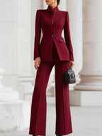 Women's formal tailored blazer and pants suit set in burgundy