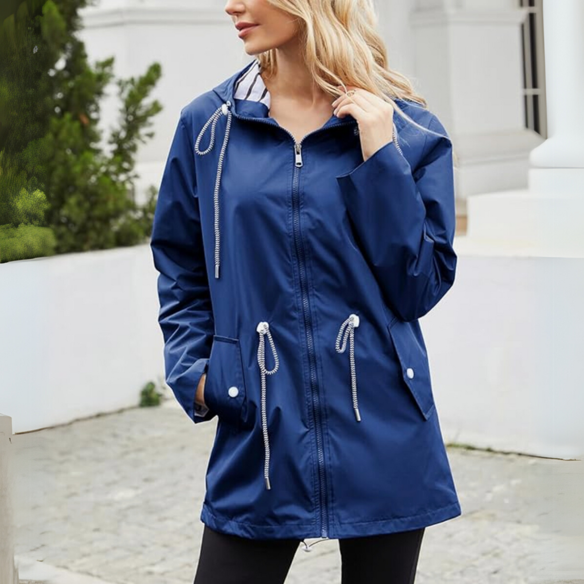 Women's sleek waterproof rain jacket with adjustable hood