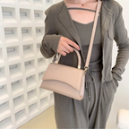 Stylish PU leather handbag featuring a top handle and a detachable crossbody strap, perfect for versatile wear and everyday use. 3