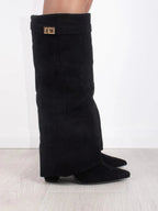 Knee high boots with a stylish flared top and comfortable block heel, perfect for fashionable fall and winter outfits. 2