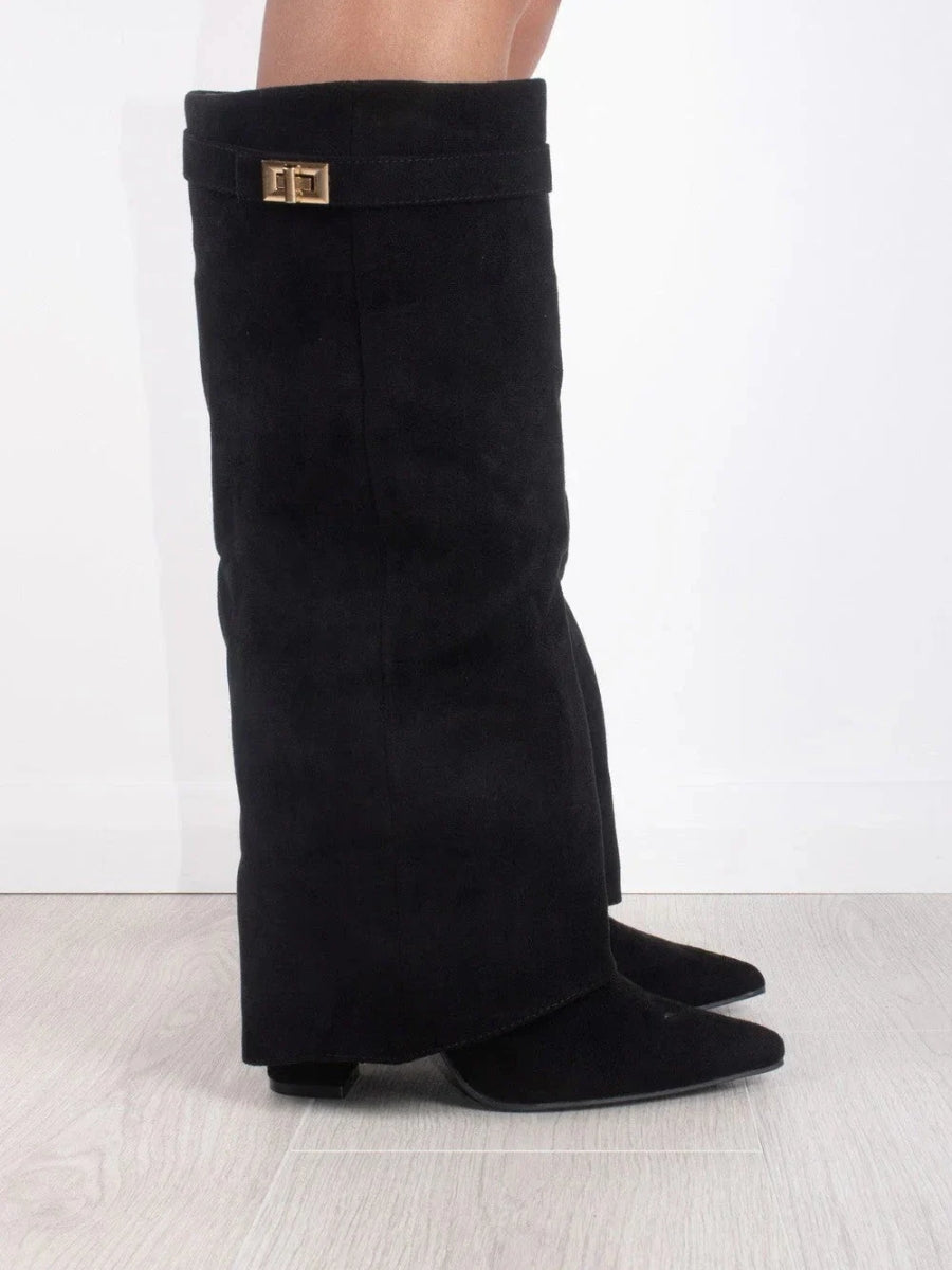 Knee high boots with a stylish flared top and comfortable block heel, perfect for fashionable fall and winter outfits. 2