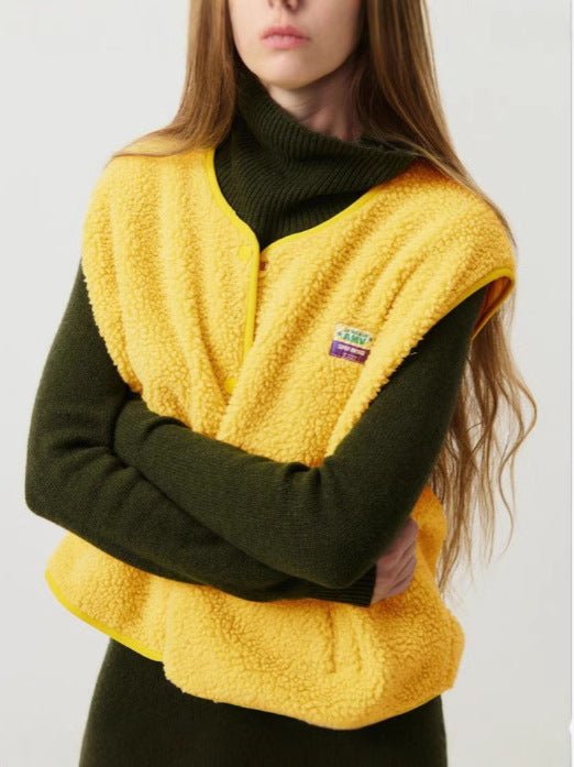 Lambswool vest with button front in slim fit, showcasing a stylish design and cozy texture, perfect for layering in cooler weather. 7