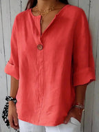 Elegant linen blouse featuring a flattering V-neckline and stylish roll tab sleeves, perfect for casual or dressy occasions. 4