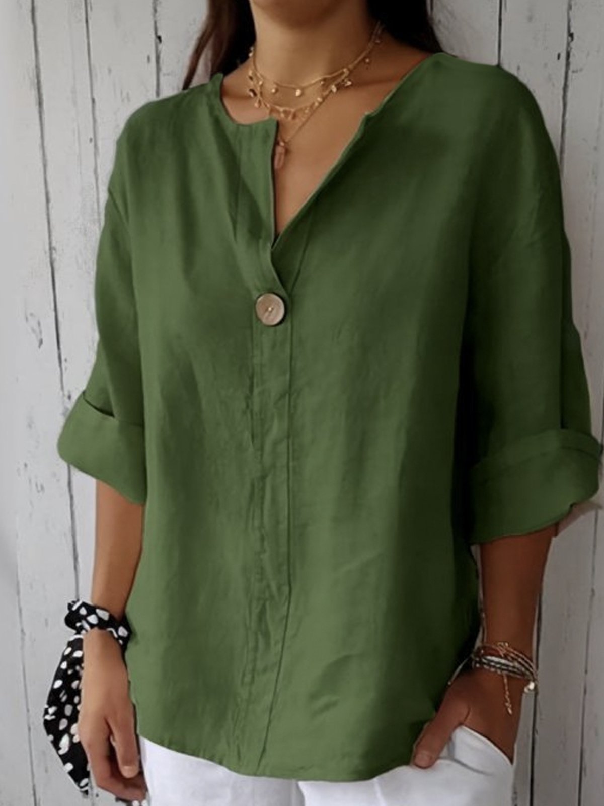Elegant linen blouse featuring a flattering V-neckline and stylish roll tab sleeves, perfect for casual or dressy occasions. 5