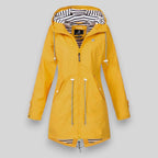 Women's sleek waterproof rain jacket with adjustable hood in yellow