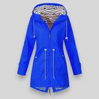 Women's sleek waterproof rain jacket with adjustable hood in bright blue
