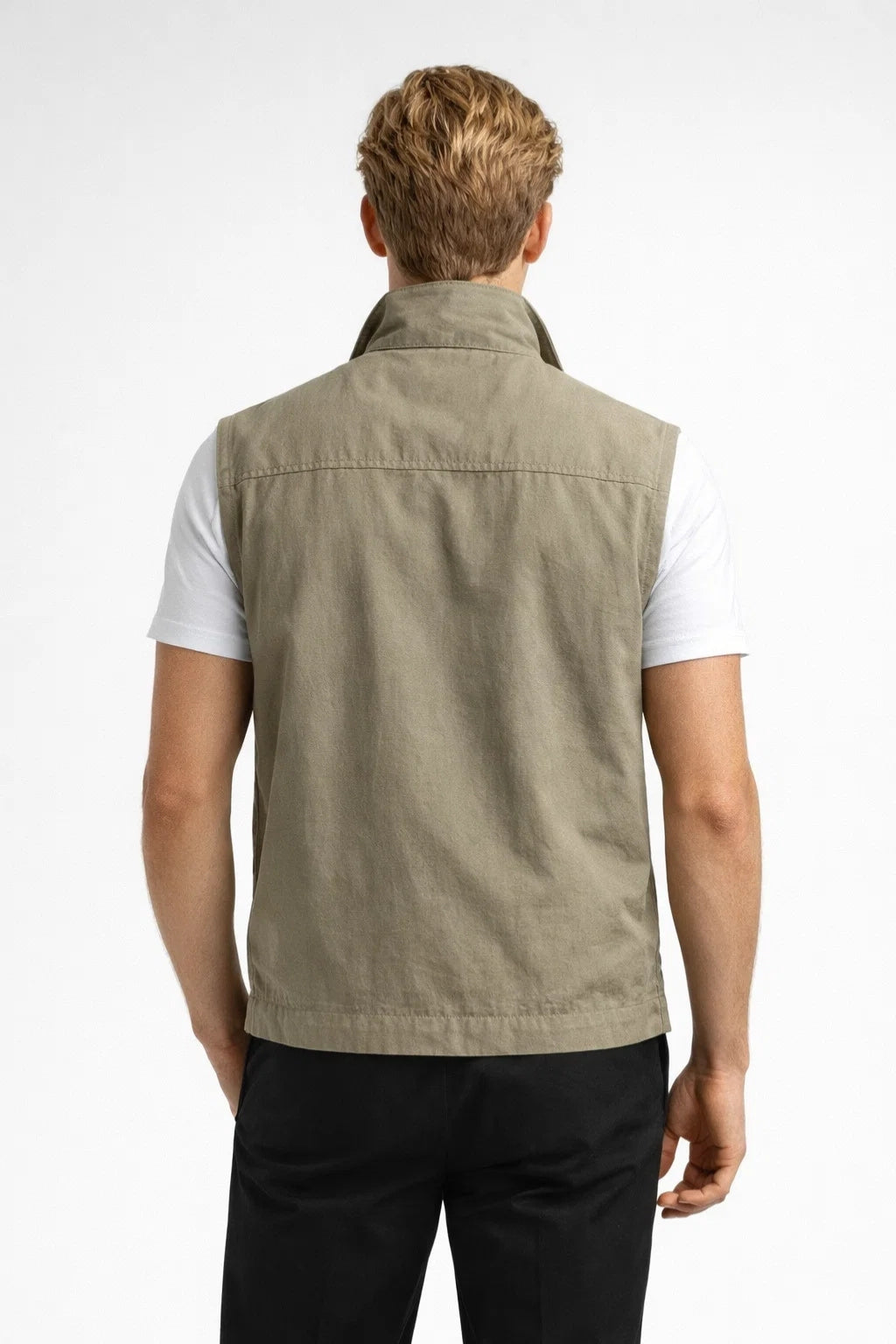 Men's lightweight vest featuring zippered pockets and a structured collar, ideal for outdoor activities and casual wear. 1