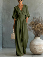V-Neck jumpsuit for women featuring a tailored fit and luxurious silk-touch fabric, perfect for elegant occasions and stylish outings. 13