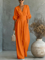 V-Neck jumpsuit for women featuring a tailored fit and luxurious silk-touch fabric, perfect for elegant occasions and stylish outings. 14