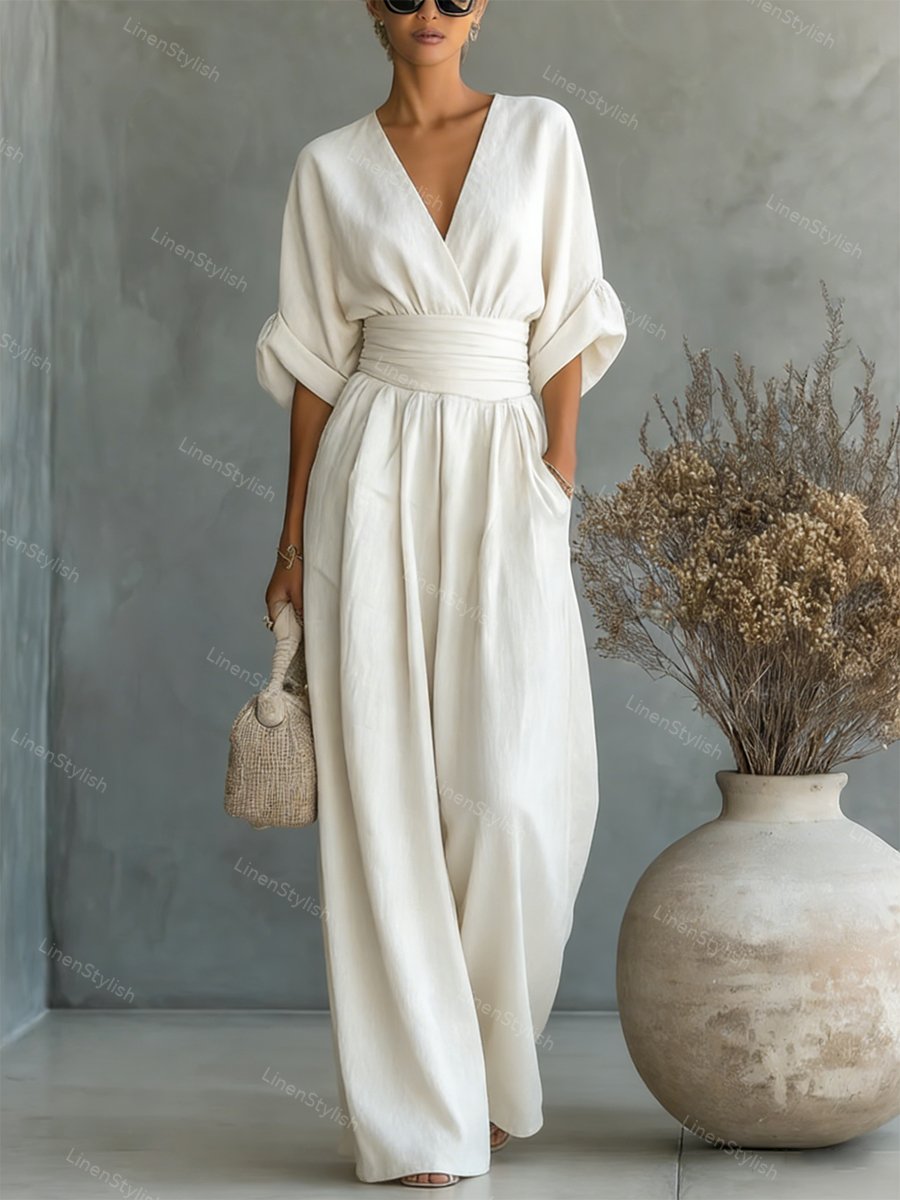 V-Neck jumpsuit for women featuring a tailored fit and luxurious silk-touch fabric, perfect for elegant occasions and stylish outings. 2