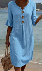 White summer dress featuring ruffled sleeves, made from a soft cotton-linen blend, perfect for warm weather outings and casual occasions. 5