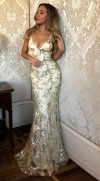 Elegant women's figure-hugging evening gown designed for gala events, featuring a flattering silhouette, intricate detailing, and a sophisticated color palette. 3
