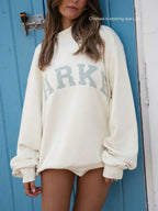 Women's oversized sweatshirt featuring soft chenille lettering, perfect for casual everyday wear and stylish comfort. 0