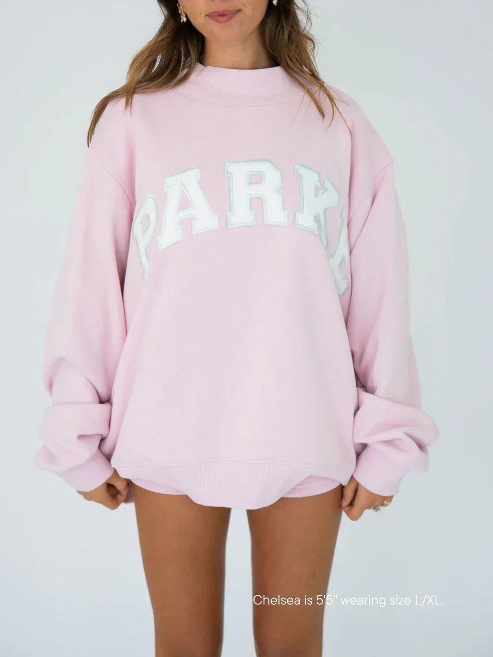 Women's oversized sweatshirt featuring soft chenille lettering, perfect for casual everyday wear and stylish comfort. 1