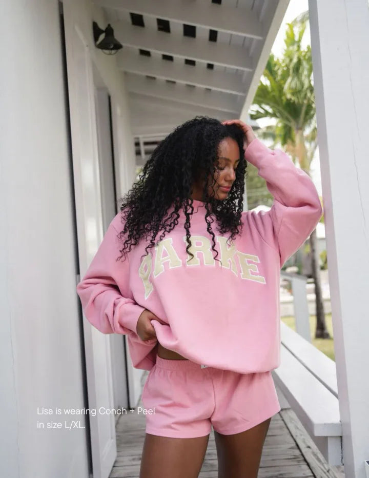 Women's oversized sweatshirt featuring soft chenille lettering, perfect for casual everyday wear and stylish comfort. 5