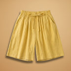 Women's relaxed fit knee-length shorts in a stylish design, perfect for casual outings and summer wear. 1