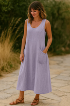 Women's relaxed maxi dress featuring stylish pockets, perfect for summer occasions, showcasing a lightweight fabric and a comfortable fit. 1