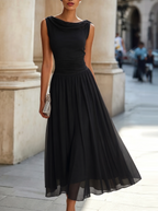 Women's sleeveless pleated midi dress in plus size, perfect for formal cocktails, featuring a flattering silhouette and elegant design. 9