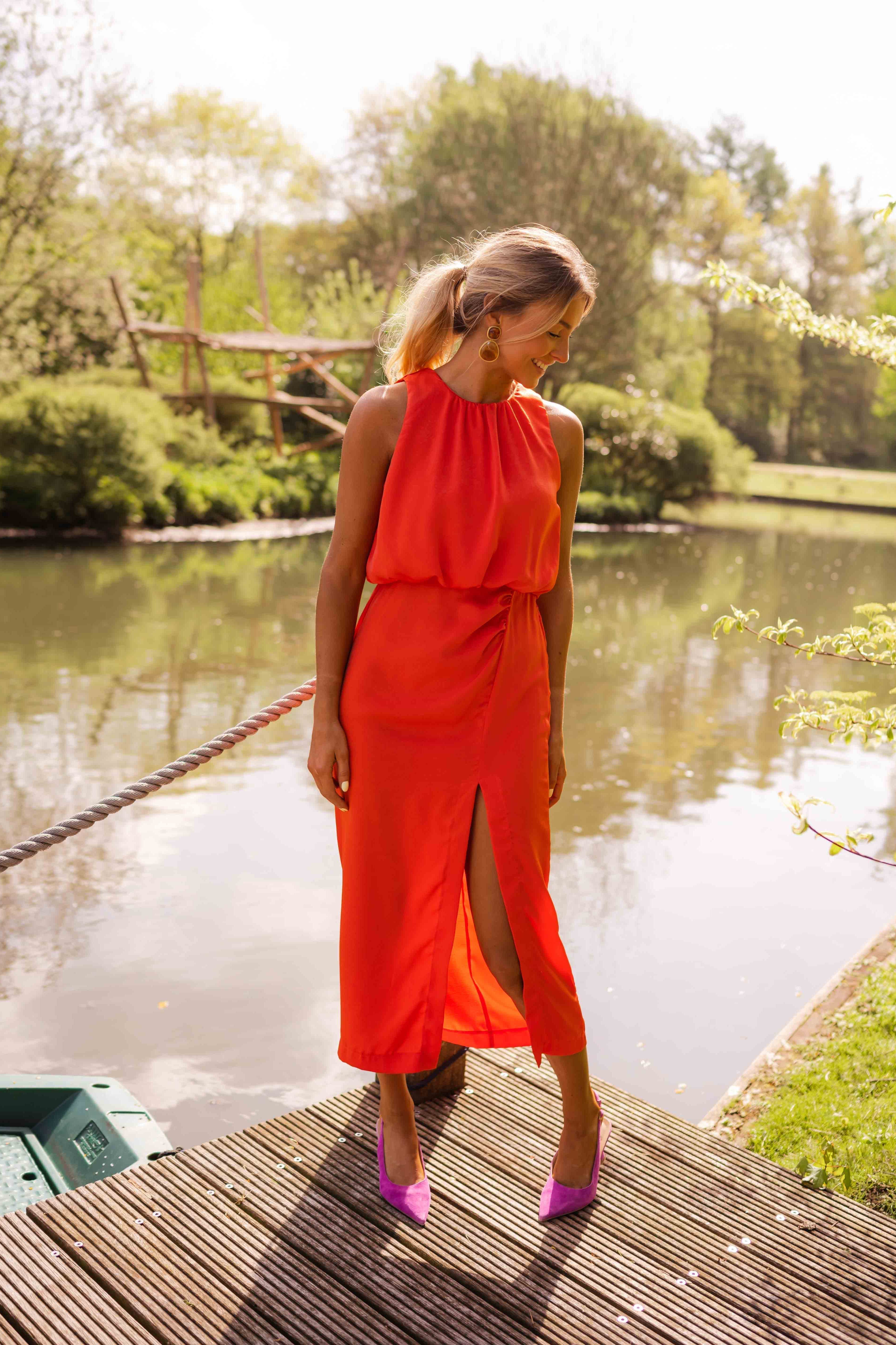 Women's slim fit midi dress featuring a sleeveless design and high neckline, perfect for summer occasions. 6