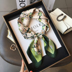 Women's square silk scarf featuring a luxurious design, ideal for versatile styling and elegant occasions, showcasing vibrant colors and a smooth texture. 0