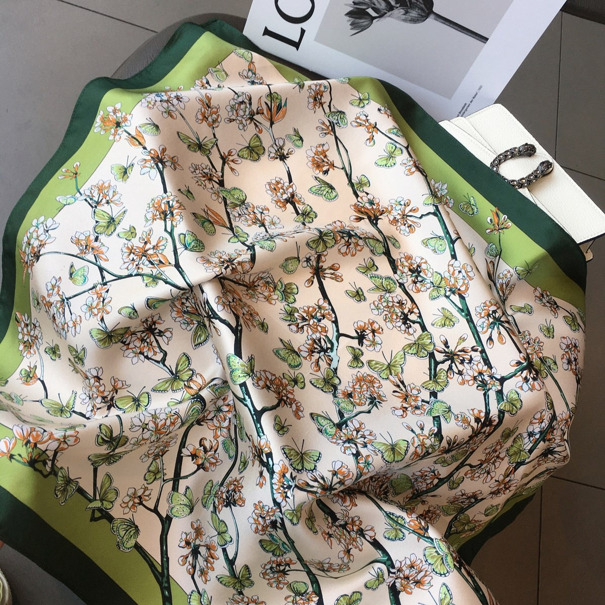 Women's square silk scarf featuring a luxurious design, ideal for versatile styling and elegant occasions, showcasing vibrant colors and a smooth texture. 5