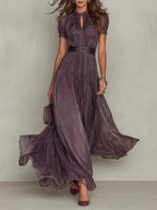 Women's elegant flowing pleated high neck maxi dress in plum